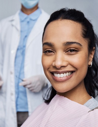 Woman smiling while sitting in treatment chair