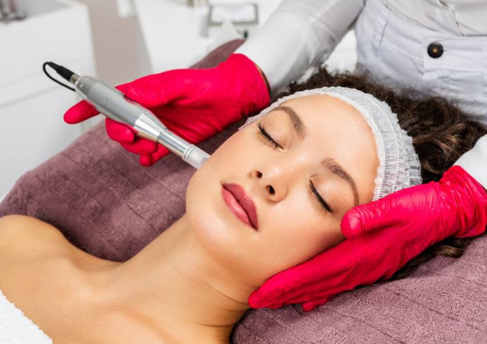 Woman relaxing while undergoing microneedling treatment