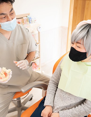 Dentures patient in Richardson talking with dentist