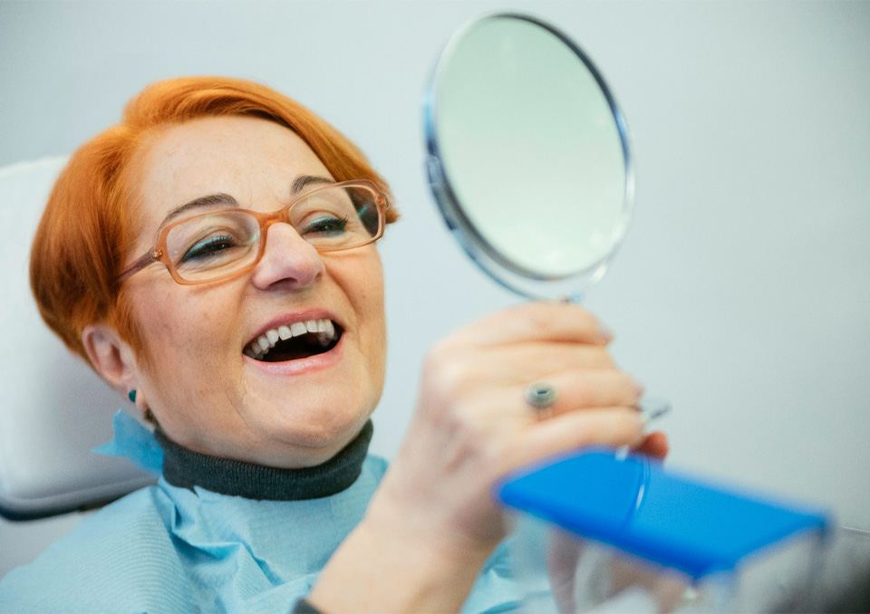 Dentures patient in Richardson smiling