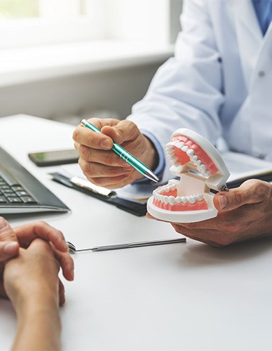 Dentures patient in Richardson talking with dentist