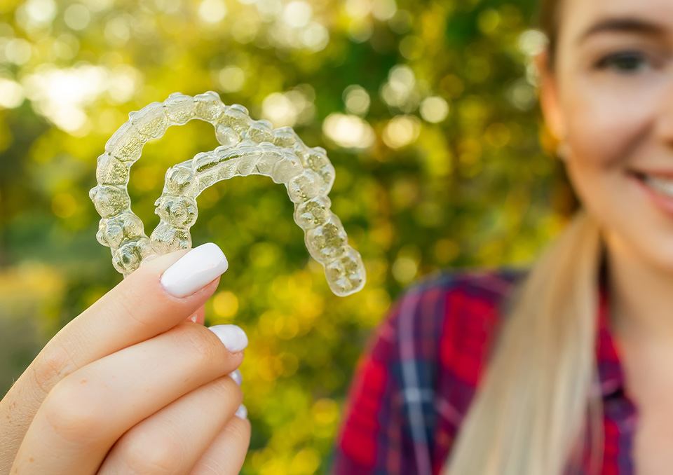 Patient in Richardson smiling with Invisalign